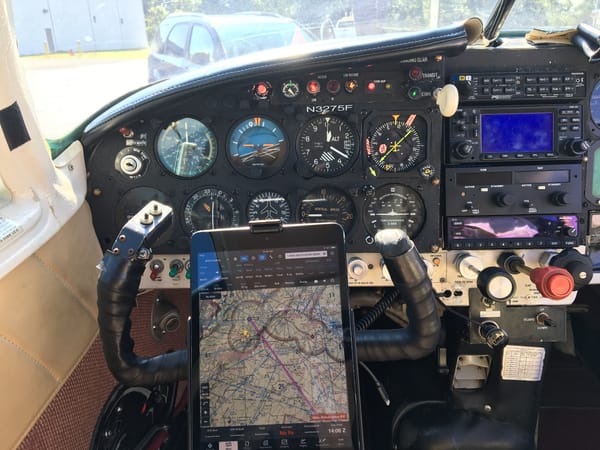 The pilot's six-pack of primary flight instruments, the N3275F placard, and an iPad running ForeFlight mounted on the yoke